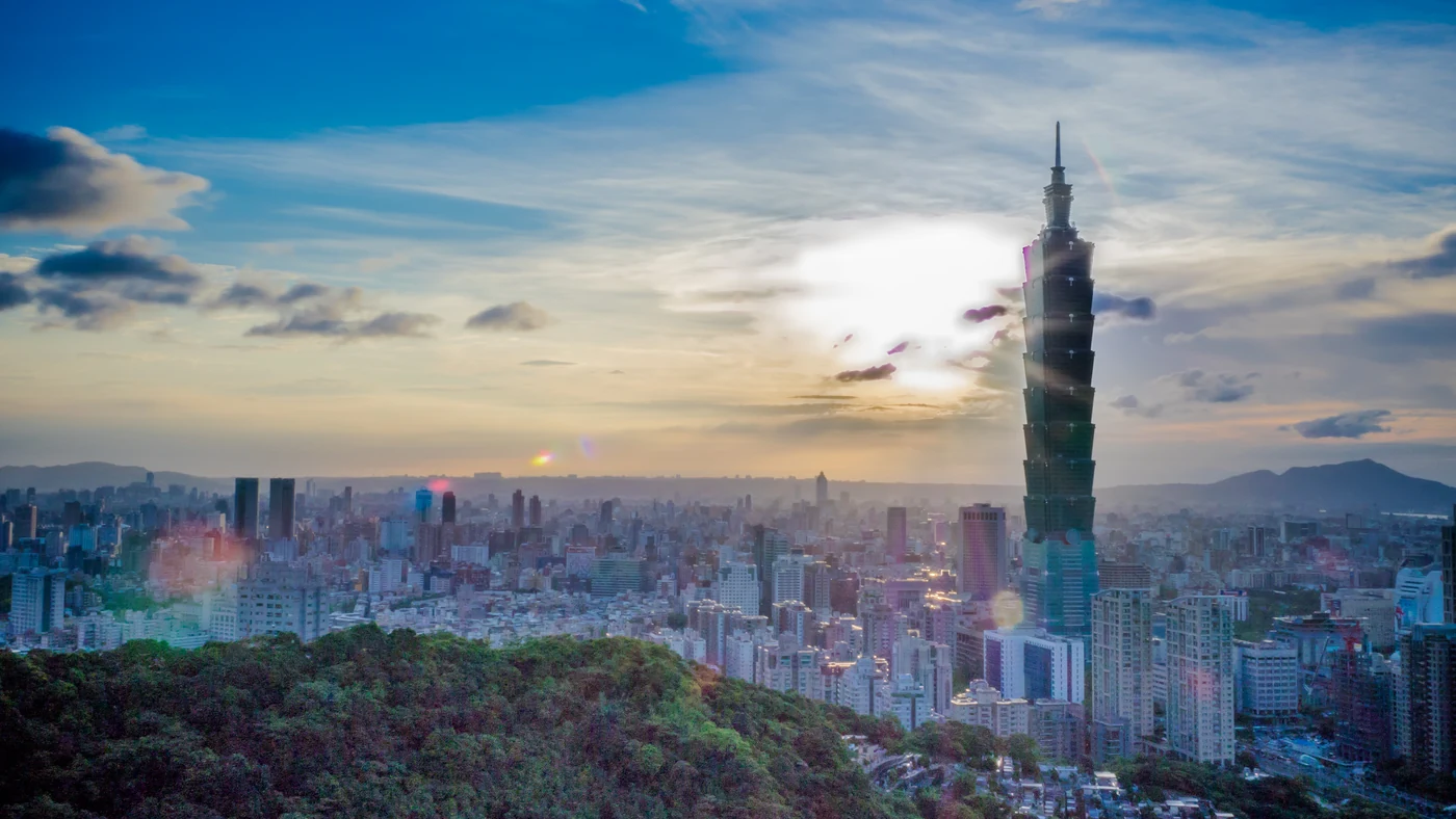Taipei skyline at sunset with Taipei 101 above the city